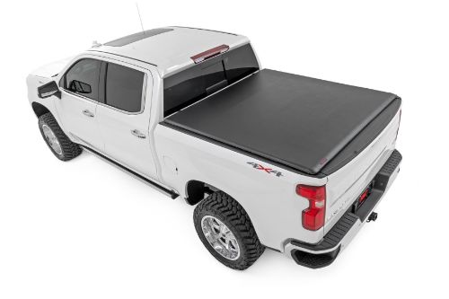 High-quality marine grade vinyl bed cover in a stylish matte black finish. Roll-up design allows quick access to cargo and full bed access quickly and conveniently. Sleek and stylish top mount cover that sits 1-1/8" high. Corrosion resistant black powder coated aluminum frame. Spring latch closure system locks in place keeping the cover tight and noise free. Single cable pull for easy latch release and access. Heavy Duty hook and loop side closure protects cargo from the elements. No drill easy install and removal - all tools included. 5 Year Warranty.