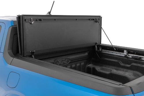 Flush, low-profile design with stylish matte black finish frame and aluminum panels. Tri-Fold 3 panel design allows full bed access. Corrosion resistant black powder coated aluminum frame. Secure track and rail mounting system with drain tubes included. Quick-connect ball-in-socket prop rods secure the cover in the fully open position. Nylon straps secure the cover in the 2/3 open position. Drive with the cover in the fully open, 2/3 open or closed position. Auto latching design secures on closure. Convenient one hand operation squeeze latches release. No drill easy install and removal - all tools included. Nylon safety straps included. 5 Year Warranty.