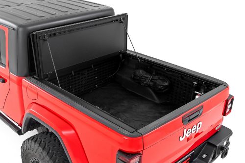 Flush, low-profile design with stylish matte black finish frame and aluminum panels. Tri-Fold 3 panel design allows full bed access. Corrosion resistant black powder coated aluminum frame. Secure track and rail mounting system with drain tubes included. Quick-connect ball-in-socket prop rods secure the cover in the fully open position. Nylon straps secure the cover in the 2/3 open position. Drive with the cover in the fully open, 2/3 open or closed position. Auto latching design secures on closure. Convenient one hand operation squeeze latches release. No drill easy install and removal - all tools included. Nylon safety straps included. 5 Year Warranty.