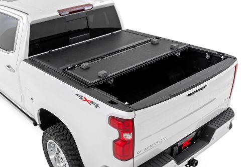 Flush, low-profile design with stylish matte black finish frame and aluminum panels. Tri-Fold Design allows quick access to cargo. Corrosion resistant black powder coated aluminum frame. Secure track and rail mounting system with drain tubes included. Nylon straps secure the cover in the 2/3 open position. Drive with the cover in the 2/3 open or closed position. Auto latching design secures on closure. Single cable pull for easy latch release and access. No drill easy install and removal - all tools included. Nylon safety straps included. 5 Year Warranty.