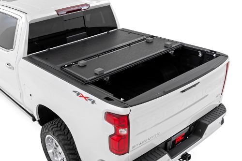 Flush, low-profile design with stylish matte black finish frame and aluminum panels. Tri-Fold Design allows quick access to cargo. Corrosion resistant black powder coated aluminum frame. Secure track and rail mounting system with drain tubes included. Nylon straps secure the cover in the 2/3 open position. Drive with the cover in the 2/3 open or closed position. Auto latching design secures on closure. Single cable pull for easy latch release and access. No drill easy install and removal - all tools included. Nylon safety straps included. 5 Year Warranty.