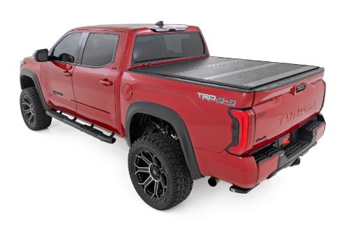 Flush, low-profile design with stylish matte black finish frame and aluminum panels. Tri-Fold Design allows quick access to cargo. Corrosion resistant black powder coated aluminum frame. Secure track and rail mounting system with drain tubes included. Nylon straps secure the cover in the 2/3 open position. Drive with the cover in the 2/3 open or closed position. Auto latching design secures on closure. Single cable pull for easy latch release and access. No drill easy install and removal - all tools included. Nylon safety straps included. 5 Year Warranty.