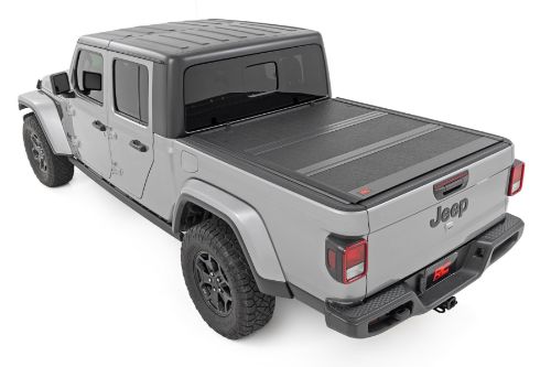 Flush, low-profile design with stylish matte black finish frame and aluminum panels. Tri-Fold Design allows quick access to cargo. Corrosion resistant black powder coated aluminum frame. Secure track and rail mounting system with drain tubes included. Nylon straps secure the cover in the 2/3 open position. Drive with the cover in the 2/3 open or closed position. Auto latching design secures on closure. Single cable pull for easy latch release and access. No drill easy install and removal - all tools included. Nylon safety straps included. 5 Year Warranty.