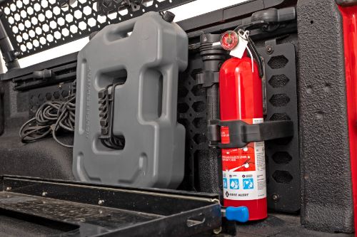 One clamp per package. Holds objects from 2 3/4" to 3 1/4" diameter. Ideal for standard fire extinguishers. Each clamp supports a safe working load of 50lbs. Mounts easily with one 6mm bolt. Mounting area 4 1/2" x 1 1/4" Includes mounting hardware compatible with Rough Country Molle panel pattern and other Military panel patterns.