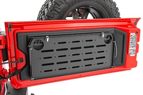 Folds flush against tailgate when not in use Rattle-free design Holds up to 75lbs! Perfect for camping and tailgating Includes two cup holders Durable steel frame construction w/ aluminum table Black powder coated finish Quick and easy installation 26.75Î“Ã‡Â¥ wide and 12Î“Ã‡Â¥ deep