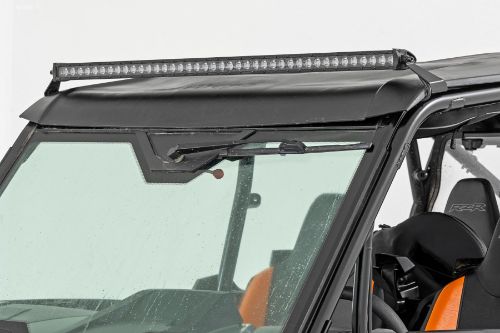Handy, forward-facing illumination. Easy, 100% bolt-on installation. Mounts to lower roll cage using factory hardware. Light bar sits above the windshield for unobstructed viewing. IP67 Waterproof design. Durable, die-cast aluminum housing. Includes snap-on cover and premium wiring harness.