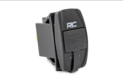 Dual USB Charger. Fits in standard rocker switch housing. Overcharging and surge protection. Compatible with devices using USB 2.0. Laser-etched RC with blue backlighting. Mounting size: 1.41 x .86 inches Surface size: Standard 2in x 1in Input: DC 12v-24v Output:DC 5v 3.1A