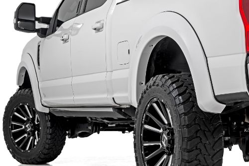Coverage: 1ΓÇ¥ Flare Height: 7ΓÇ¥ Quick and easy install with no drilling. Added protection from rocks, mud, and other road debris. UV protected to prevent fading. Built from a special Tri-Blend ABS material for maximum strength and durability. Easily paintable to color match your truck. Can be removed to bring the truck back to stock. 3-year limited warranty.